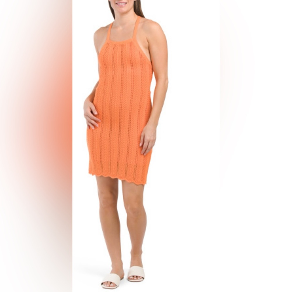 Sleeveless Crochet mini dress,partially lined,crisscross back with tie detail.